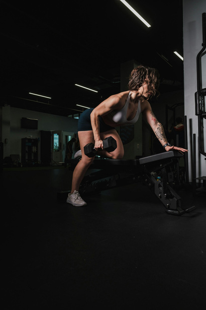 Athlete training with a dumbbell